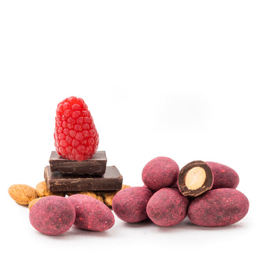 Translation missing: de.Zarte Versuchung von Snackberries – Mandelkerne in Zartbitterschokolade mit Himbeerpulver