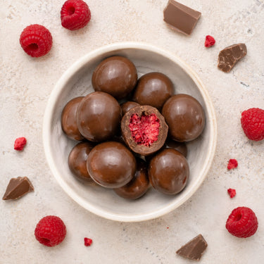 Translation missing: de.Gefriergetrocknete Himbeeren in Vollmilchschokolade